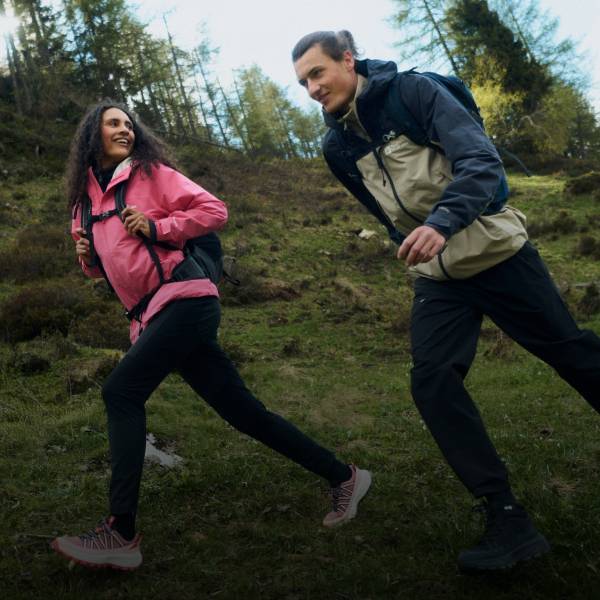 Two friends hiking through woodland